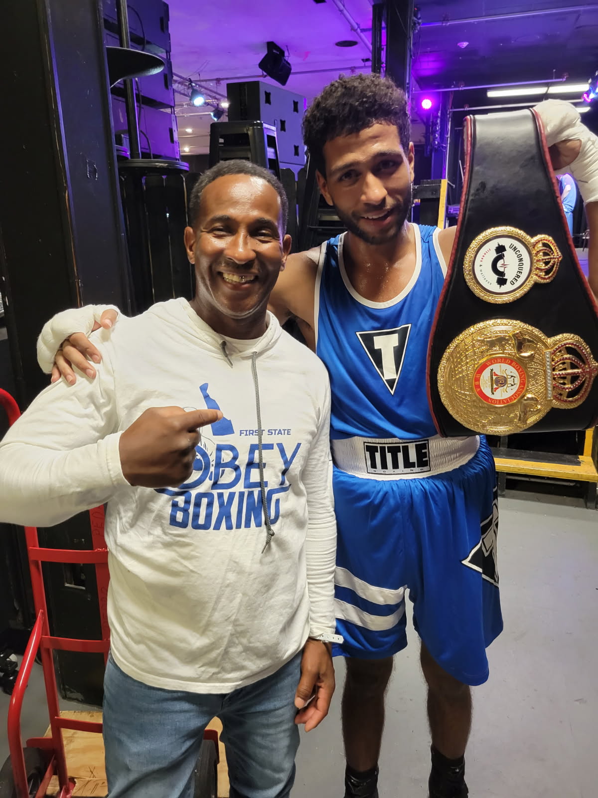 Coach Ant with championship fighter
